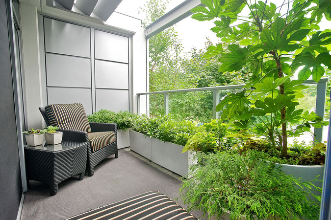 Balcony with planter boxes full of greenery