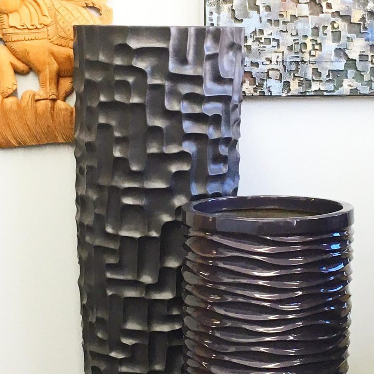 Tall fiberglass outdoor planters ideal for entrances and commercial properties.