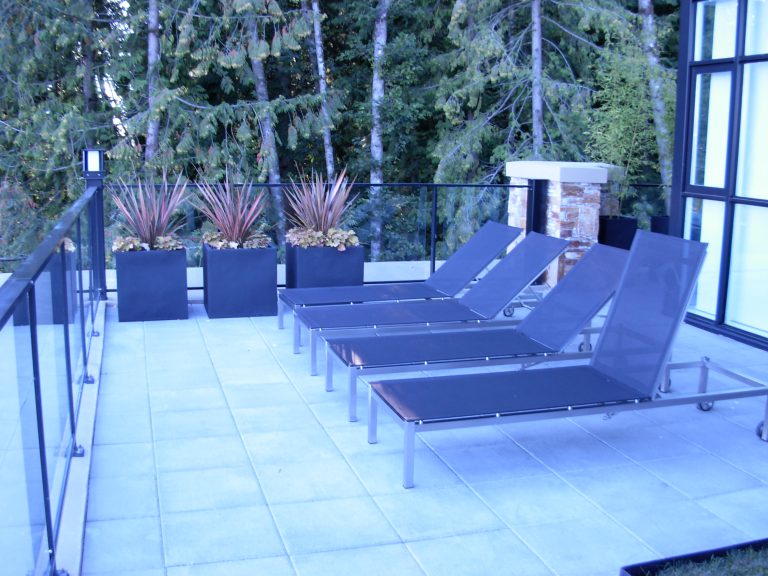 Large square planters at a Whistler residence designed for contemporary style and year-round durability.